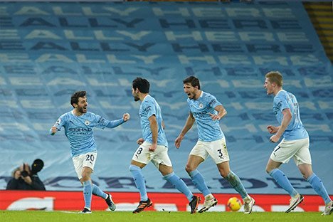 Selebrasi pemain Manchester City usai Ilkay Gundogan bobol gawang Crystal Palace. (c) AP Photo