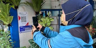 QRIS BRI: Solusi Cerdas untuk Pedagang Bunga Pasar Bratang