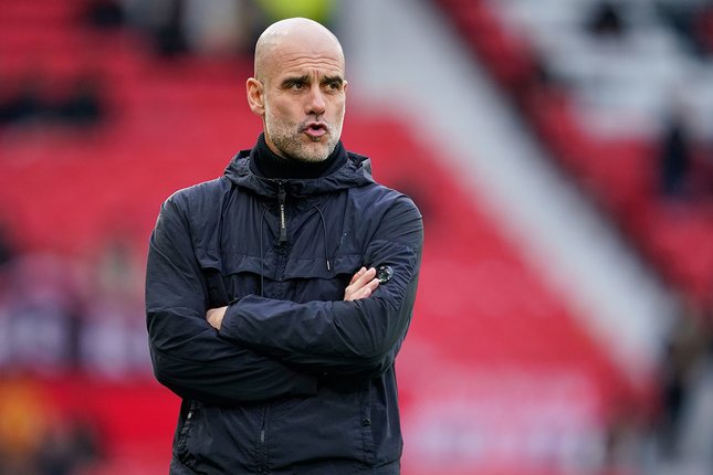 Pelatih Manchester City, Pep Guardiola. (c) (AP Photo/Dave Thompson