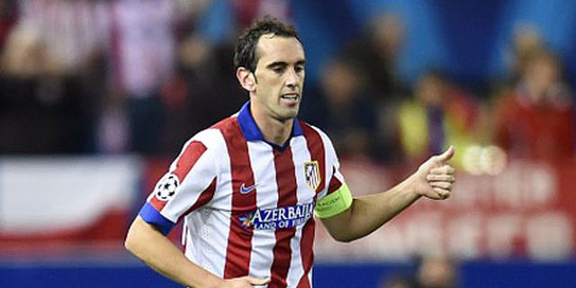 Godin: Madrid Buat Atletico Bertahan Mati-matian