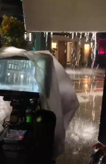 Behind the scenes of soap opera heavy rain accompanied by lightning.
