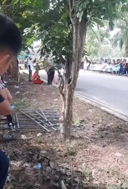 Action of mothers watching motor racing.