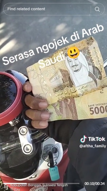 Passenger Mistakenly Pays with Riyal, Motorcycle Taxi Driver Feels Like He's in Saudi Arabia