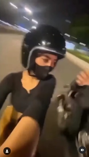 Moments of a Female Motorcyclist Almost Being Robbed While Vlogging on Sudirman Street