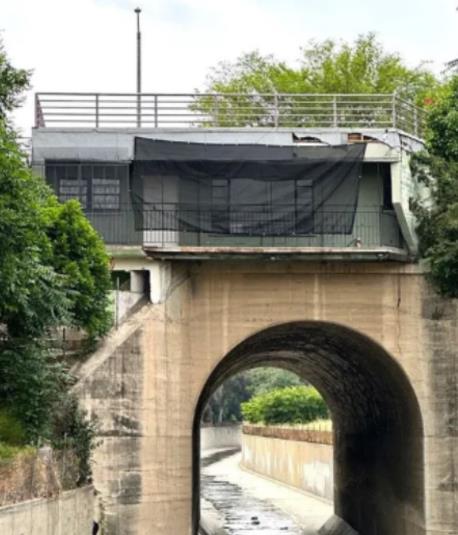 Unique house above the bridge.