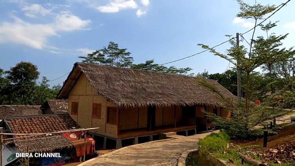 Humble house with ijuk roof and bamboo woven walls.