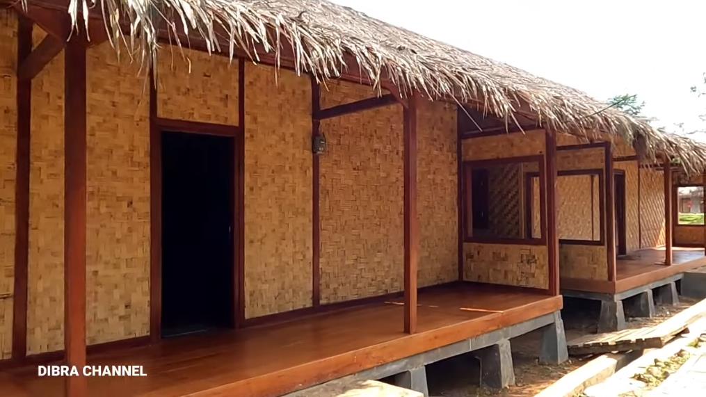 Humble house with ijuk roof and bamboo woven walls.