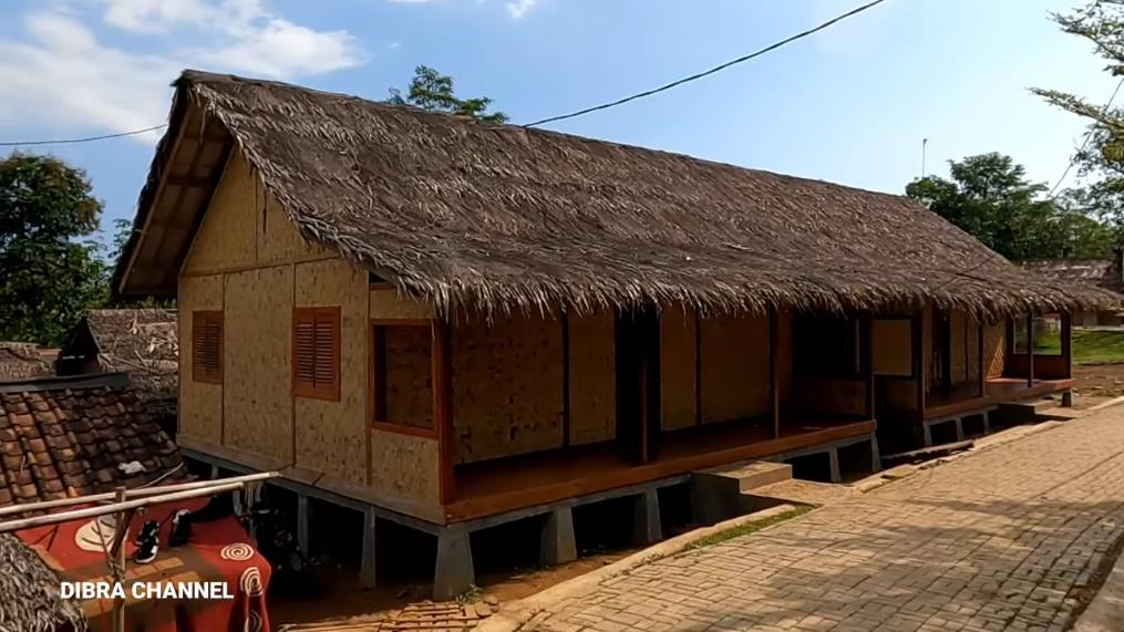 Humble house with ijuk roof and bamboo woven walls.