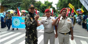 Banser Bantu Amankan Karnaval Milad Muhammadiyah