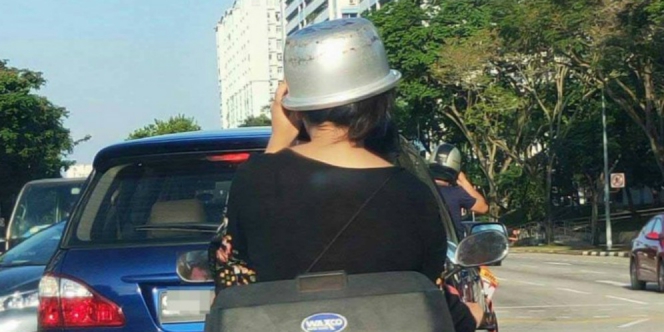 Viral! Wanita Pakai Panci Rice Cooker untuk Helm