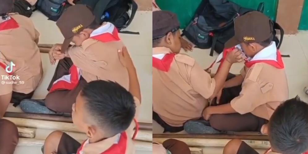 Aksi Menyentuh Anak SD Tenangkan Teman yang Menangis dengan Menepuk Punggung dan Seka Air Matanya Bikin Terharu