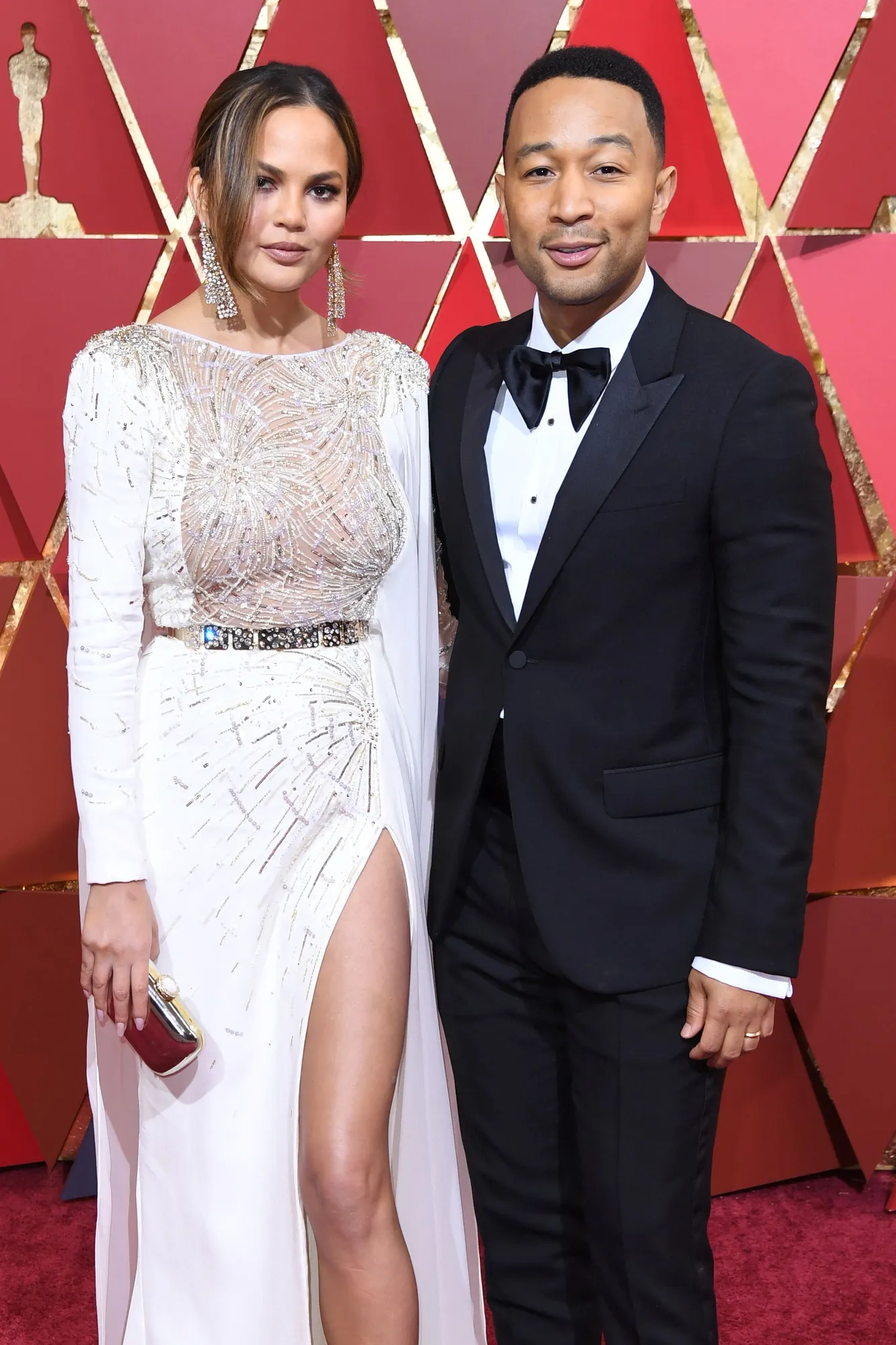 Pasangan John Legend dan Chrissty Teigen hadir bersama di Oscar 2017. ©AFP
