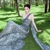 Lin Yun Tampil Glamor di Pemotretan Terbaru, Pakai Gaun Shimmering di Pinggir Pantai