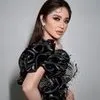 Potret Dewi Perssik Tampil Glamor Pakai Gaun Hitam Berkilau di D'Academy 7