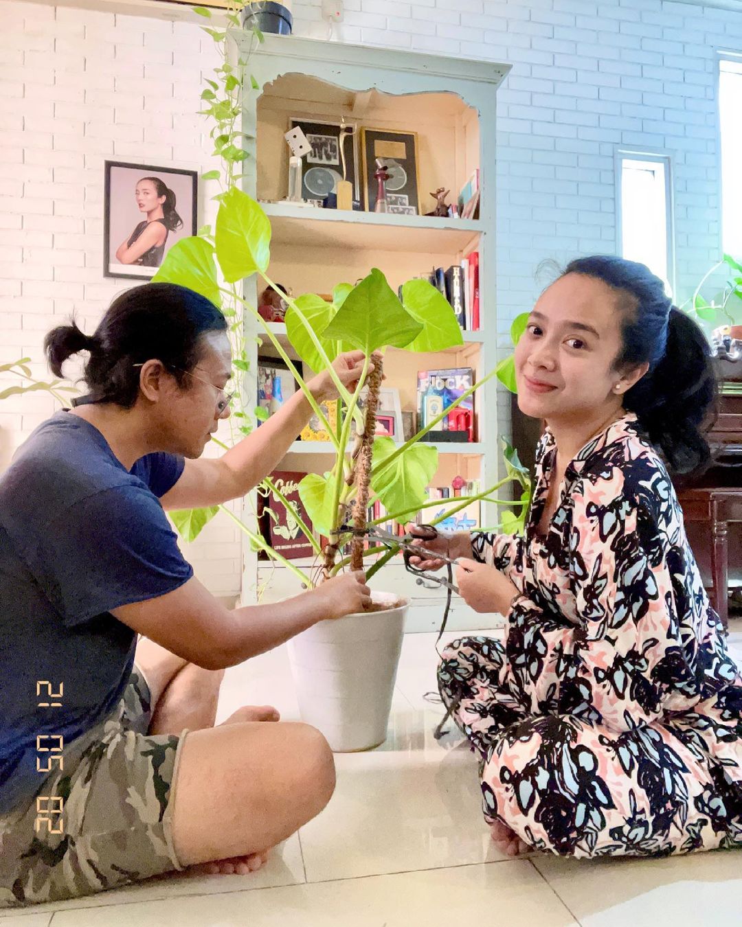 Dea and Ariel are busy taking care of their plants.