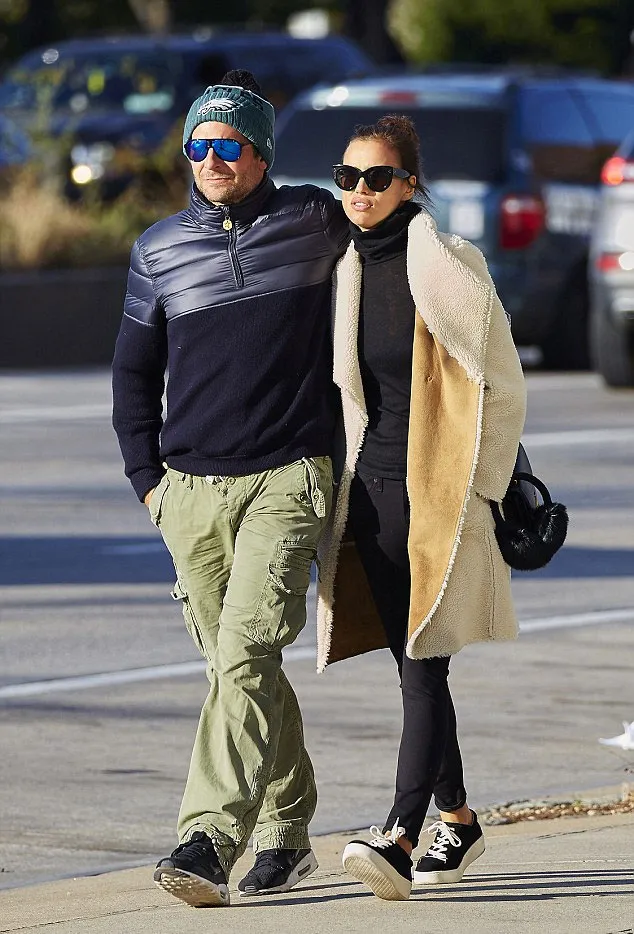 Bradley rangkul Irina mesra © Splashnews.com