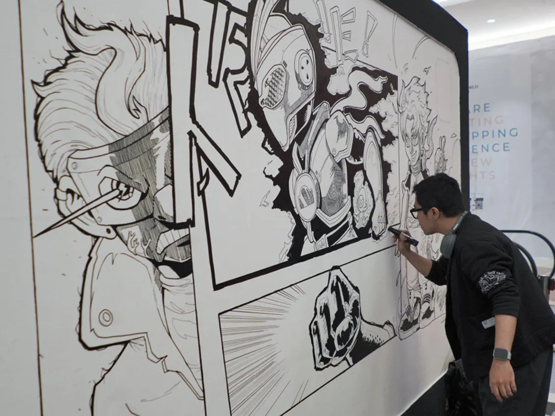 Fery Woketoon melakukan live drawing. (c) Mie Sedaap