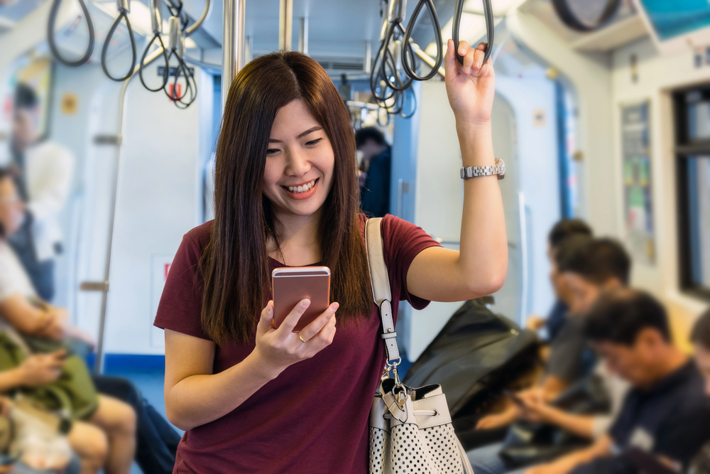 Illustration of a woman taking the MRT. (c) Tzido/Depositphotos.com