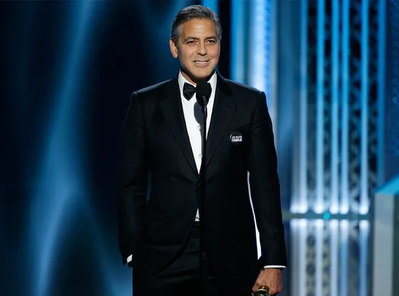 George mengenakan tuxedo pernikahannya @ eonline.com
