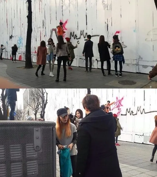 Girls Generation melakukan self-promotion dengan membuat grafiti di tembok gedung SM Entertainment @soompi.com