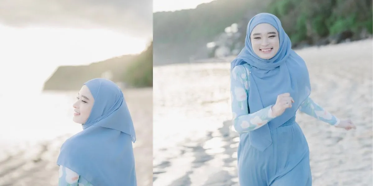 Portrait of Inara Rusli Staying Cool Using Hijab Syari while Going to the Beach