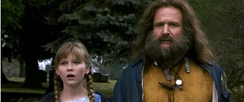 Kirsten Dunst dan Robin Williams dalam film JUMANJI tahun 1995 ©cinemablend.com