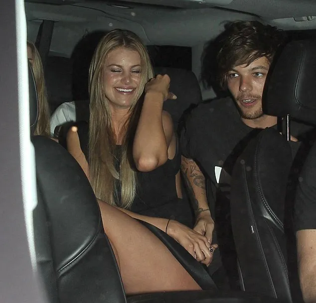 Louis Tomlinson tertangkap kamera bergandengan tangan dengan seorang wanita © Dailymail