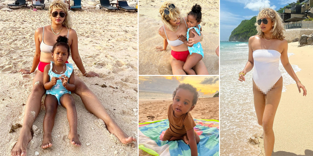 10 Hot Photos of Mama Kimmy Jayanti Wearing Swimsuits and Two-Piece Bikinis on the Beach While Taking Care of 2 Children