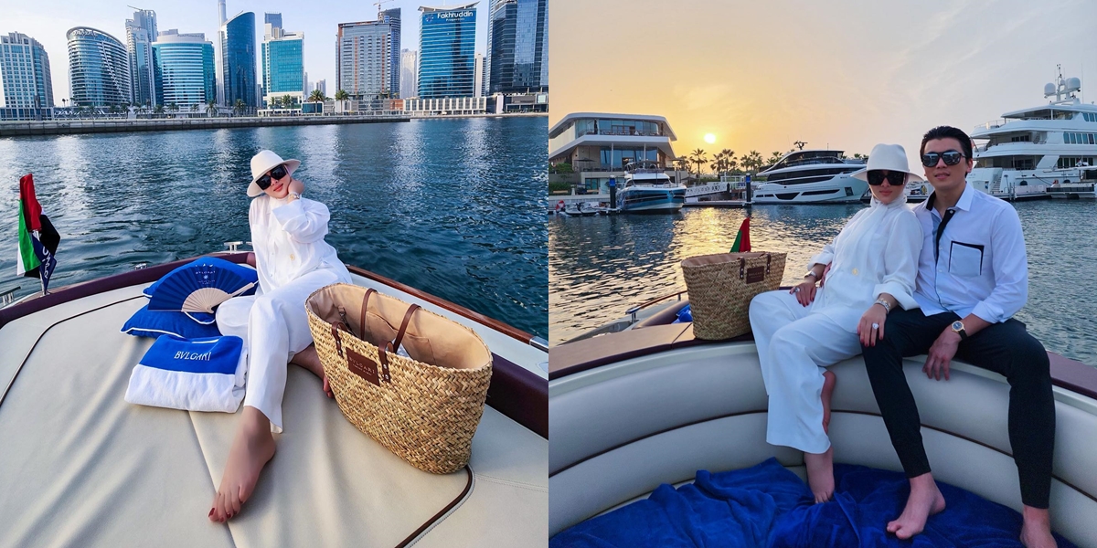 10 Portraits of Syahrini Enjoying the Beauty of Dubai City by Boat, Very Romantic Leaning on Reino Barack's Embrace