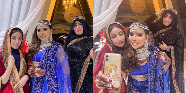 8 Potraits of Eva Belisima, Kiwil's ex-wife, as an Indian girl at the Mehendi Night, showing meaningful henna with pictures of herself and her future husband, a foreign businessman