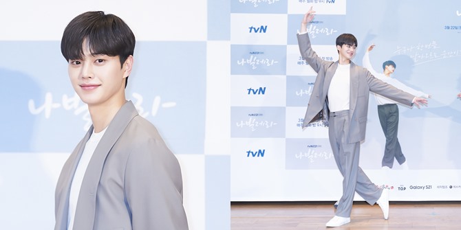 Song Kang Poses Like a Ballerino at 'NAVILLERA' Press Conference, Similar to the Poster Behind Him
