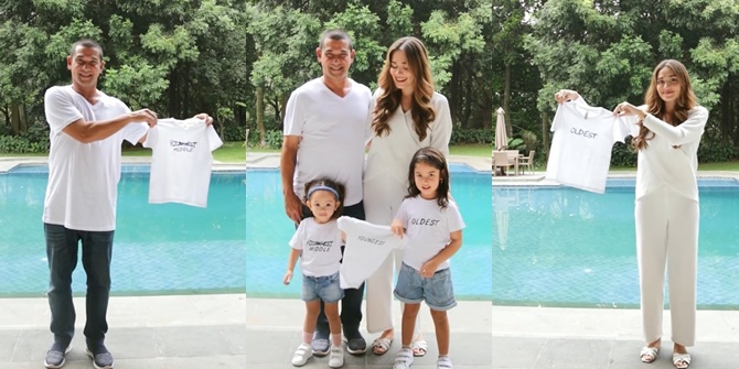 Photo of Yasmine Wildblood Announcing Third Pregnancy in a Unique and Adorable Way with Husband and Two Daughters