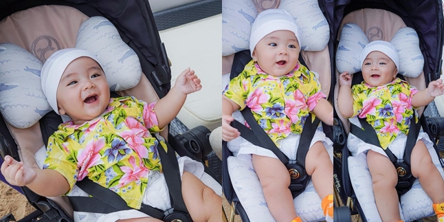 Portrait of Happy Abecio, Momo's First Child, Playing on the Beach, Riding a Stroller Worth a Motorcycle