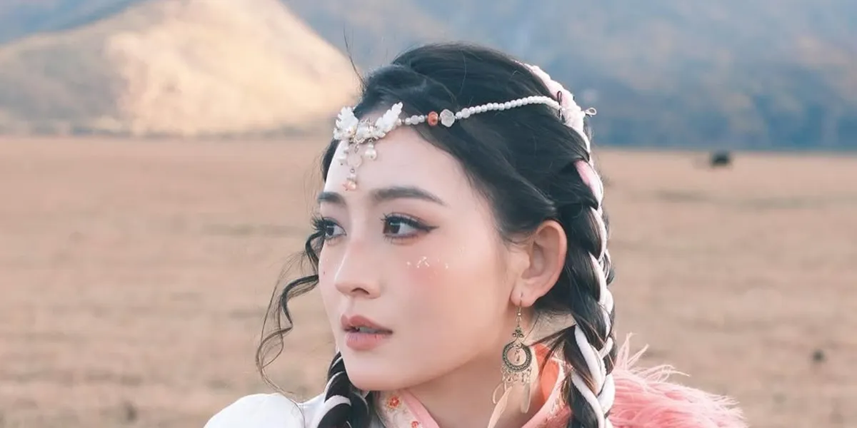 Beautiful Portrait of Natasha Wilona in China, Wearing Traditional Tibetan Dress in Blush Pink