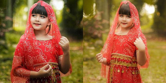 Portrait of Ciara Brosnan, Star of 'CINTA AMARA', Wearing a Red Indian Dress, She Looks Beautiful