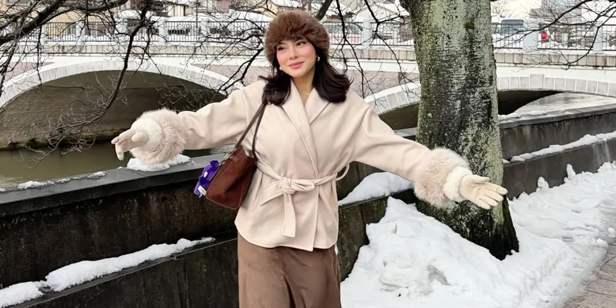 Portrait of Hanum Mega Happy to Play in the Snow for the First Time