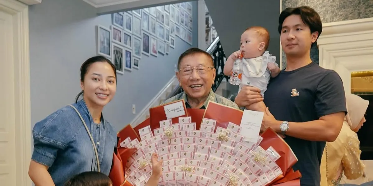Portrait of Nikita Willy Attending Her Grandfather's Birthday Celebration, Giving a Bucket of Money Gift