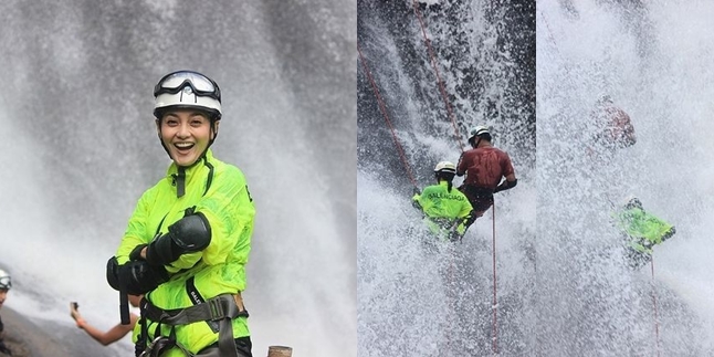 Portrait of Ririn Ekawati Sliding at Waterfall, Extraordinary Courage - Looking Cool Using World-Class Brands