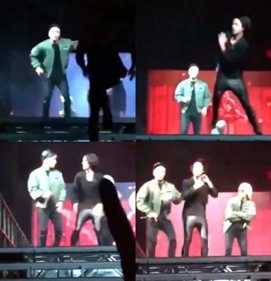 Salah seorang penggemar tiba-tiba naik panggung di konser Big Bang. © koreaboo.com