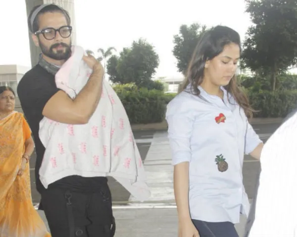 Shahid tutup wajah Misha dengan selimut agar tak terpotret wartawan ©bollywood