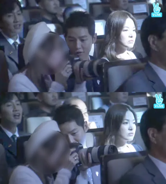 Song Joong Ki yang tampak kepo pada fans BTS. ©soompi.com