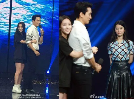Sosok Liu Yifei saat menyaksikan Song Seung Hun dipeluk fans. ©soompi.com