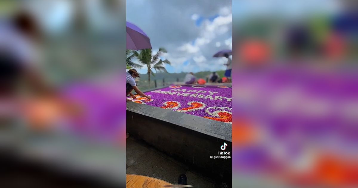 Momen Pegawai Hotel di Bali Gagal Pertahankan Tulisan dari Bunga di Kolam Renang saat Hujan Ini Viral, Bikin Nyesek