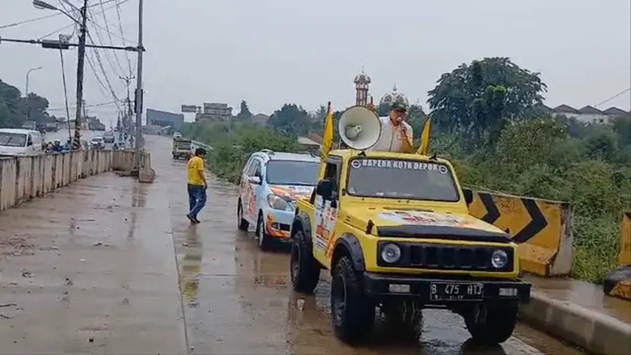 Anggota DPRD Kota Depok, Tajudin Tabri saat melakukan kampanye diduga menggunakan plat nomor palsu di wilayah Pancoran Mas, Depok (Istimewa)