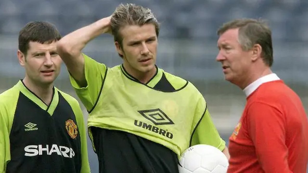 David Beckham dan Alex Ferguson (PATRICK HERTZOG / AFP)
