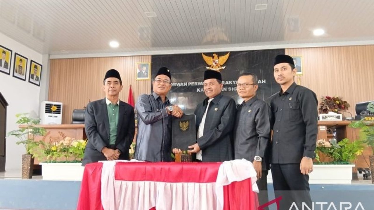 DPRD Sigi dan Pemerintah Kabupaten Sigi sahkan Perda pengelolaan aset daerah serta pembentukan Kecamatan Sigi Kota, langkah strategis dorong pembangunan dan kesejahteraan masyarakat.