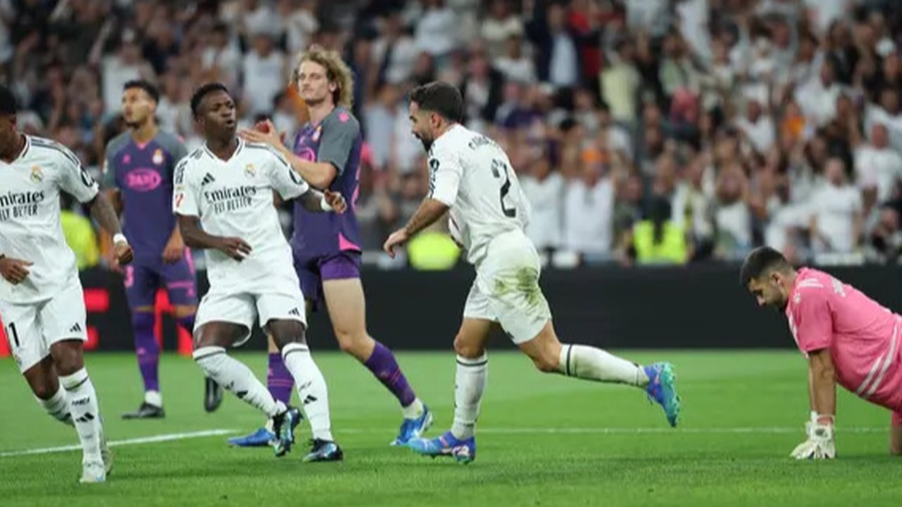 Sempat tertinggal lebih dulu, Los Blancos berhasil menyamakan skor lewat gol Dani Carvajal pada menit ke-58. (Thomas COEX/AFP)