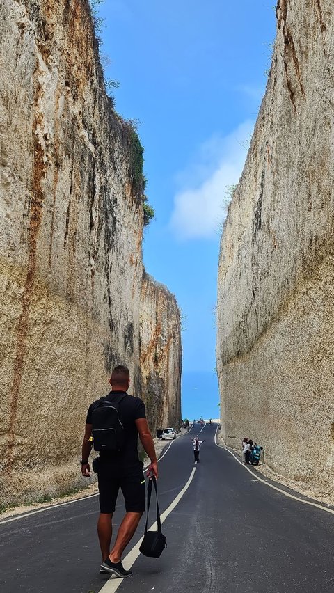 The beauty of the road that cuts through the limestone cliff towards Pandawa Beach Bali.