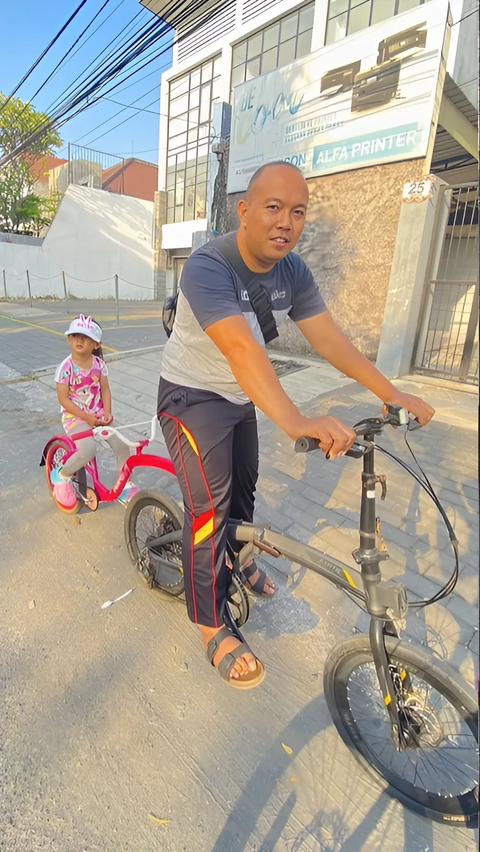 So Sweet, Father Rides His Bike with His Daughter's Pink Bike