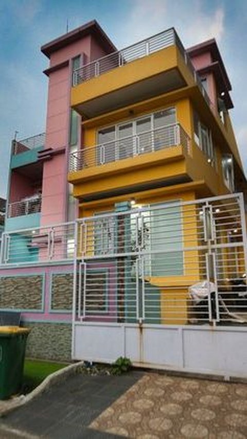 This is a picture of the colorful front part of Rey Utami's luxury house.